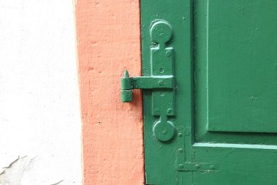 Close-up of metallic hinge on door