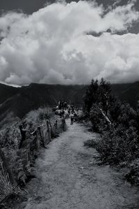 Scenic view of landscape against cloudy sky