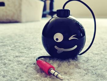 Close-up of ball on rug at home