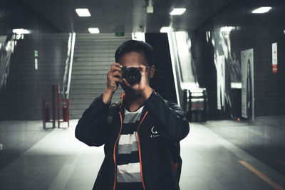 Young man photographing