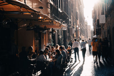 People on city street amidst buildings