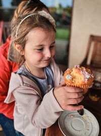 Close-up of girl eating food