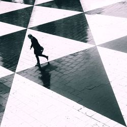 High angle view of people walking on footpath