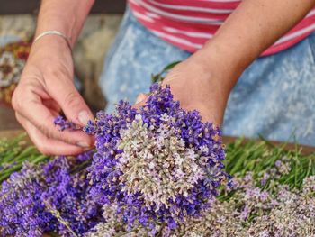 Midsection of woman holding bouquet