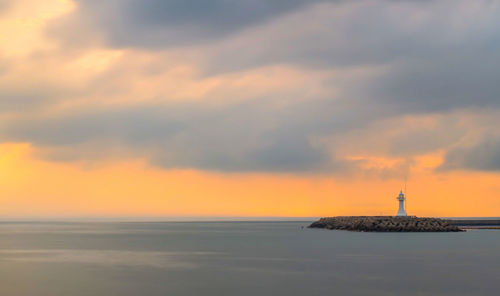 Scenic view of sea at sunset