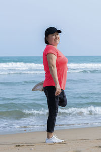 Full length of man standing on beach