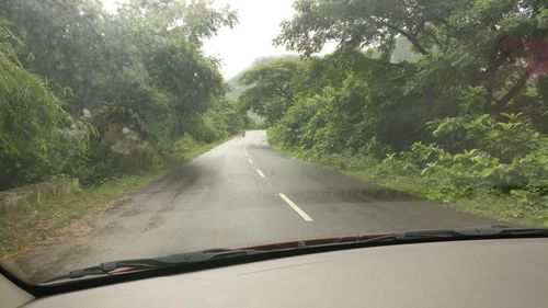 Road seen through car windshield