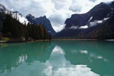 Scenic view of lake and mountains against sky