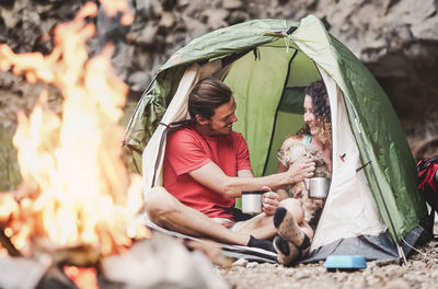 Woman with dog and son outdoors