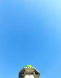 Low angle view of building against clear blue sky