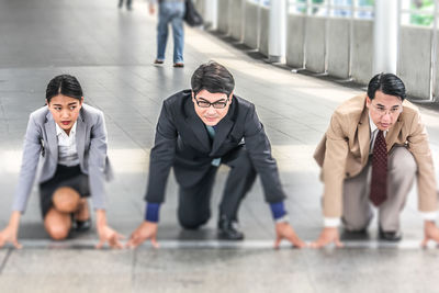 Colleagues preparing to run on bridge