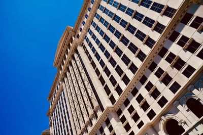 Low angle view of building against clear blue sky