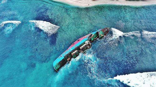 High angle view of people on boat in sea