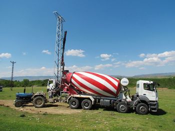 Tractor on field against sky