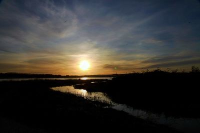 Scenic view of sunset over lake