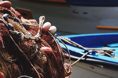 Fishing net against boats at harbor