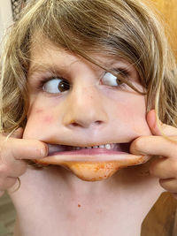 Close-up portrait of a girl eating food