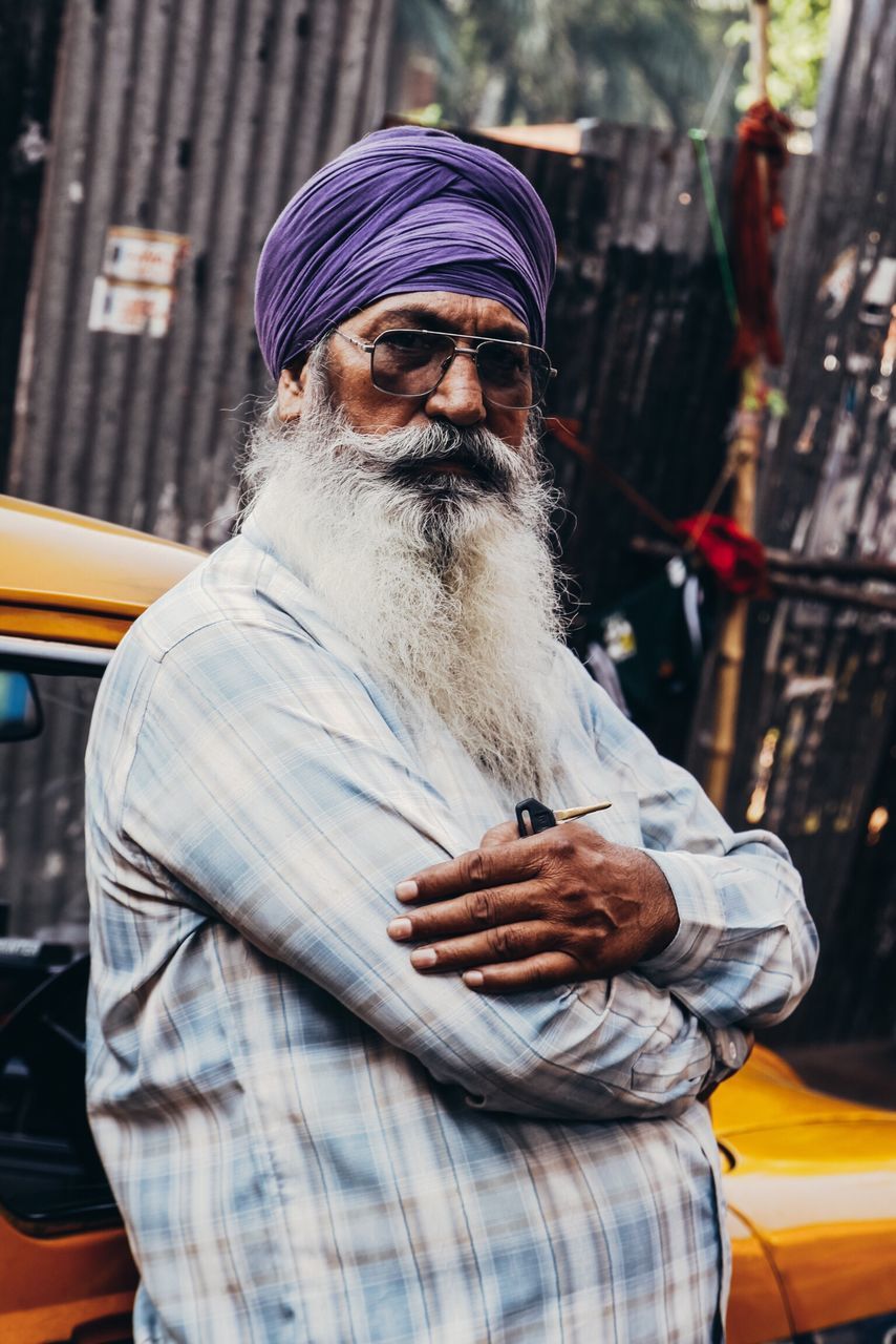 one person, one man only, adults only, only men, beard, waist up, focus on foreground, front view, outdoors, real people, traditional clothing, people, adult, day