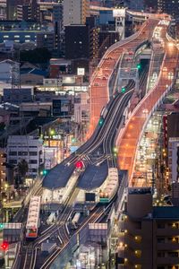 High angle view of illuminated buildings in city