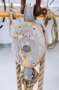 Close-up of rope tied to pulley in boat