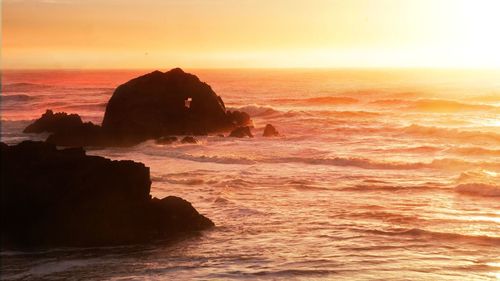 Scenic view of sea against sky during sunset
