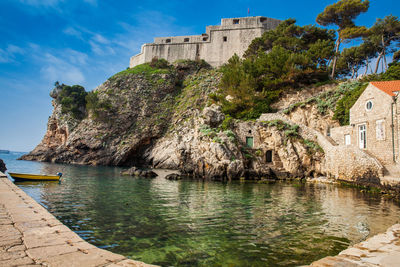 Dubrovnik west pier and the medieval fort lovrijenac located on the western wall of the city