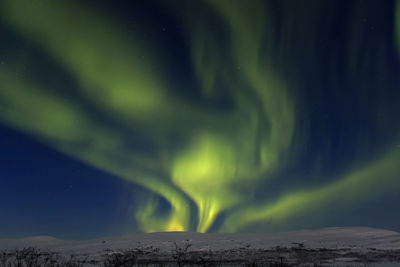 Scenic view of landscape against sky at night