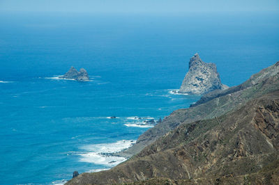 High angle view of sea against blue sky