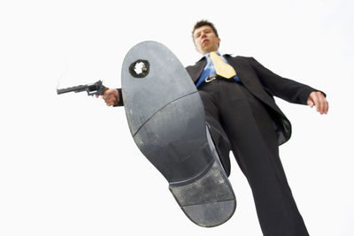 Man holding camera against white background