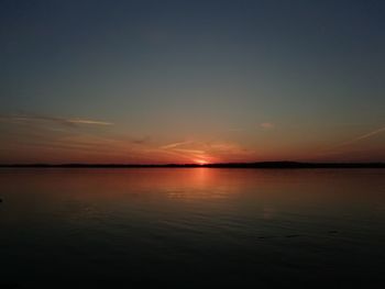 Scenic view of sea against romantic sky at sunset