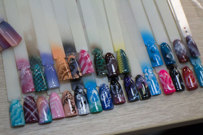 Close-up of multi colored pencils in row