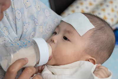 Close-up of cute baby drinking water