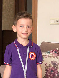 Portrait of boy smiling at home