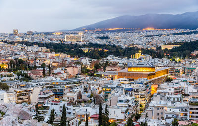 High angle view of illuminated cityscape against sky