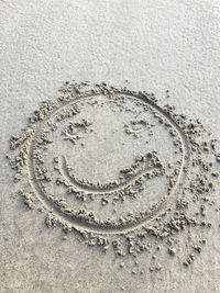 High angle view of heart shape on sand