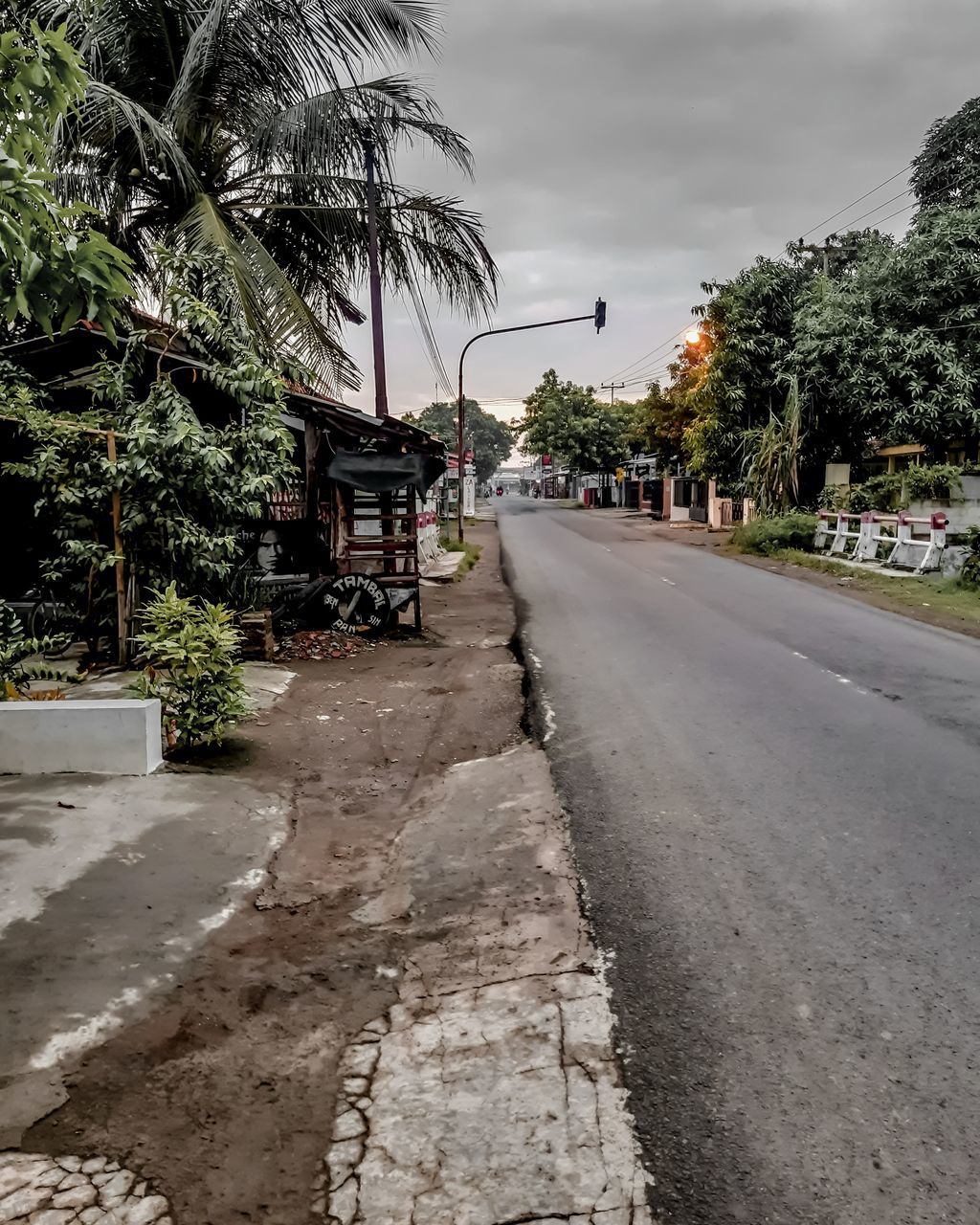 ROAD BY BUILDING AGAINST SKY