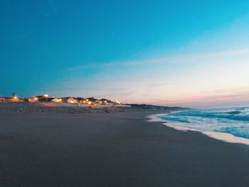 Scenic view of beach against sky during sunset