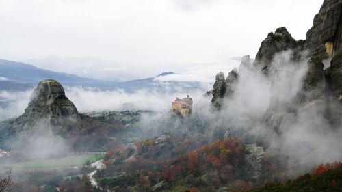 Scenic view of fog in mountain and forest