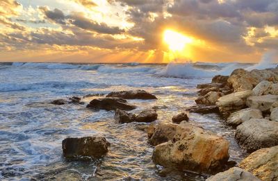 Scenic view of sea against sky at sunset