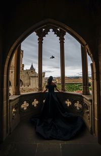 Rear view of bride standing at church balcony