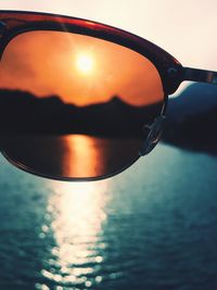 Reflection of sun in water at sunset