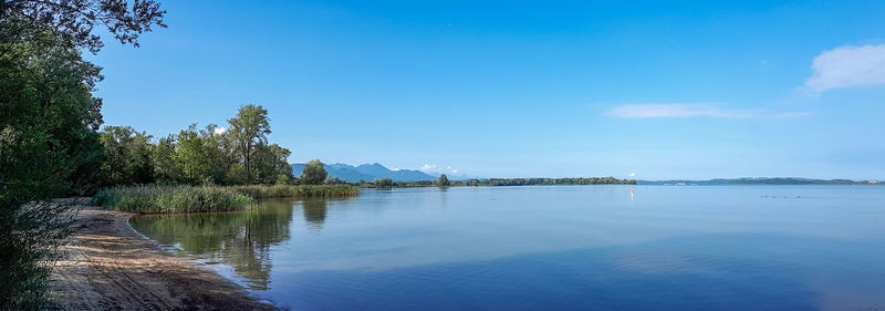 Scenic view of lake against blue sky