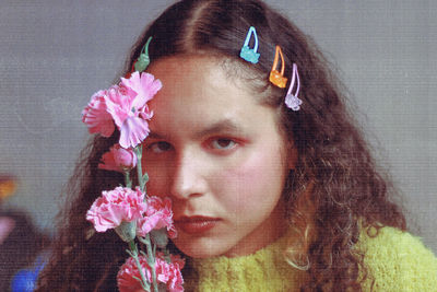 Close-up of young woman with flowers