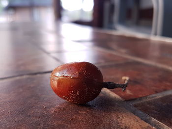 Close-up of wet strawberry on table