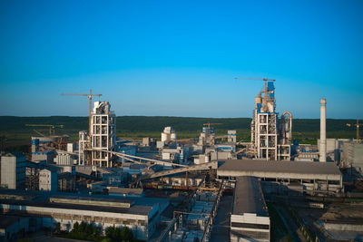 View of factory against blue sky