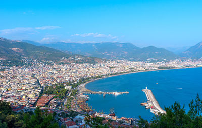 Aerial view of the port with ships and a lighthouse in the city of alanya in turkey