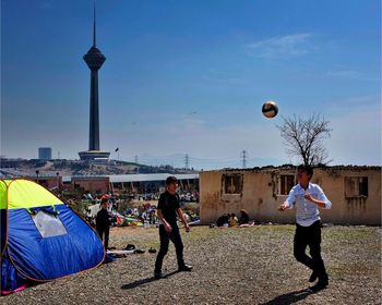Woman standing against sky
