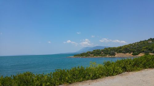 Scenic view of sea against blue sky