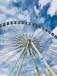 Low angle view of ferris wheel against sky