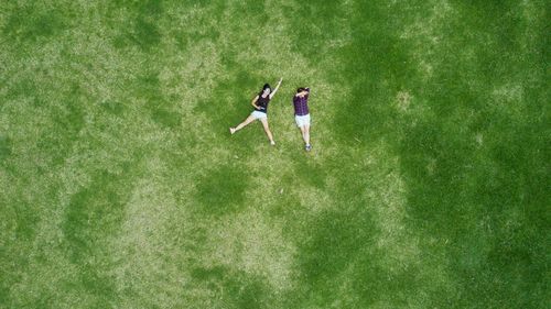 High angle view of young couple on grass